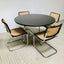 Natural rattan dining chair with sleek metal frame.