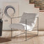 Minimalist lounge chair with a floating fabric seat design.