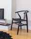 Black wishbone chair with woven seat