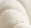 Plush white boucle chair with rounded sculptural design