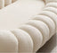 Plush white boucle chair with rounded sculptural design