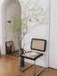 Cesca dining chair with rattan seat and galvanized iron frame.