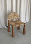 Handcrafted wooden chair with a rustic woven seat design.