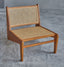 Solid ash wood lounge chair with natural rattan.
