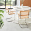 Pair of oak and rattan cantilever chairs with chrome frames against white wall