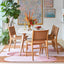 U saddle leather dining chair with a curved backrest design.