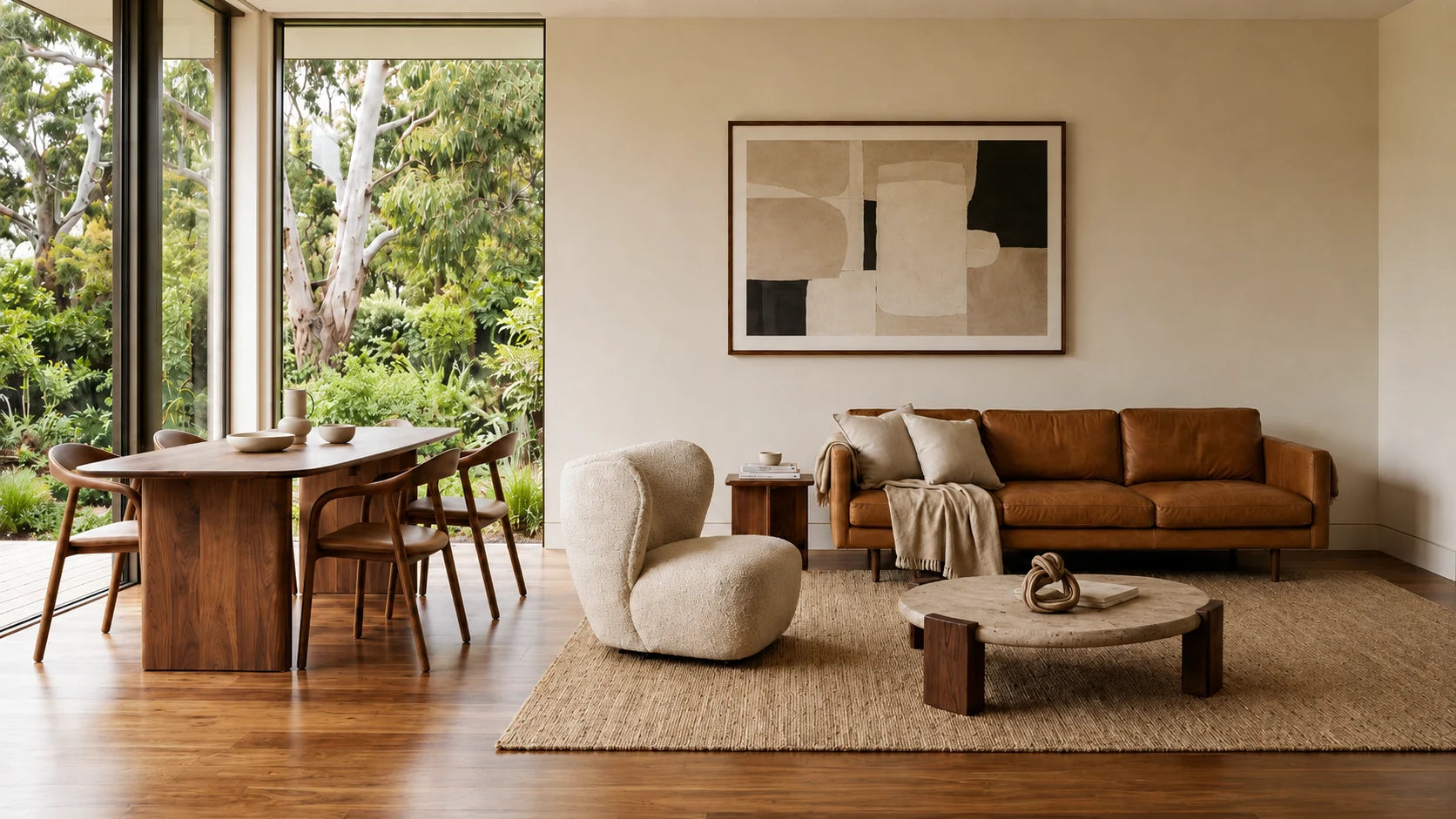 Refined seating gallery with timber dining chairs, a boucle accent chair and a leather sofa in a warm Australian interior